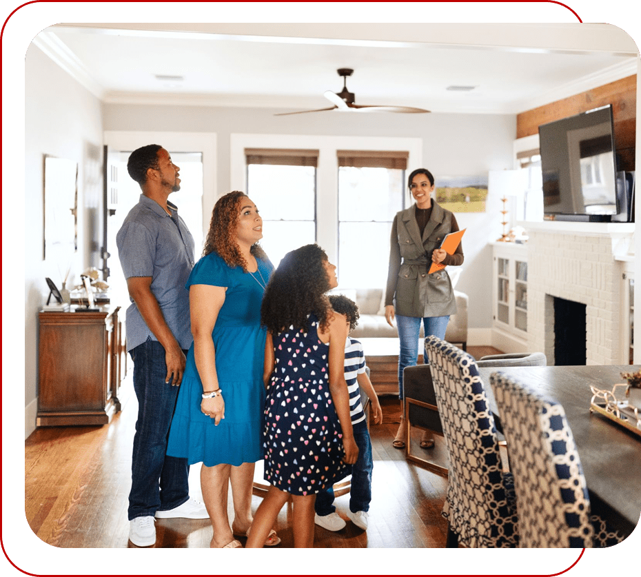 Family touring a home with a realtor.